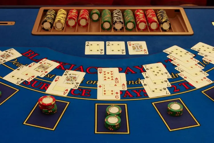 blackjack table with cards and chips